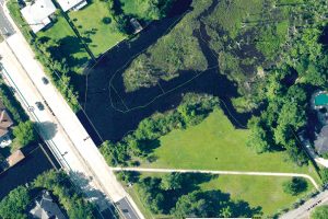 Aerial of Christopher Creek shows the portion east of San Jose Boulevard that has a marshy island created by decades of silt build-up.