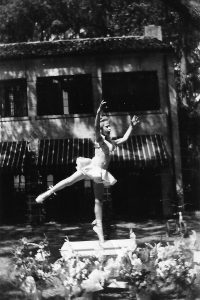 Lee Beger posing in the backyard of her childhood home in San Jose