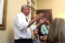 Matt Carlucci, former City Council member and State Farm Insurance agent, points out the financial effects of flooding to City representatives and neighbors.