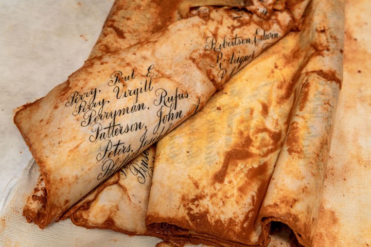 A soggy wad of parchment displays some of the names of 1,220 Floridians who served and died during World War I.