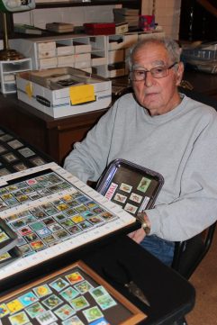 William Rose with stamp collection