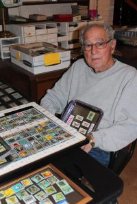 William Rose with stamp collection